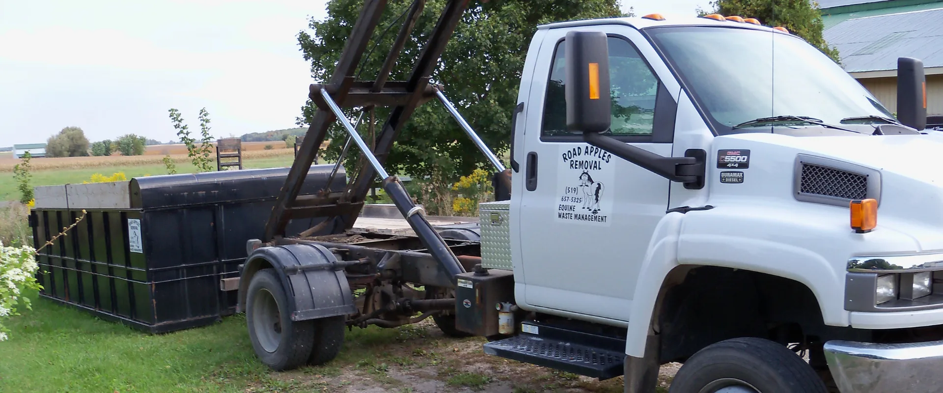 Road Apples Removal truck delivering bin to farm